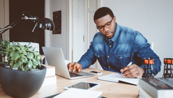 professional reviewing life event trigger campaign on laptop