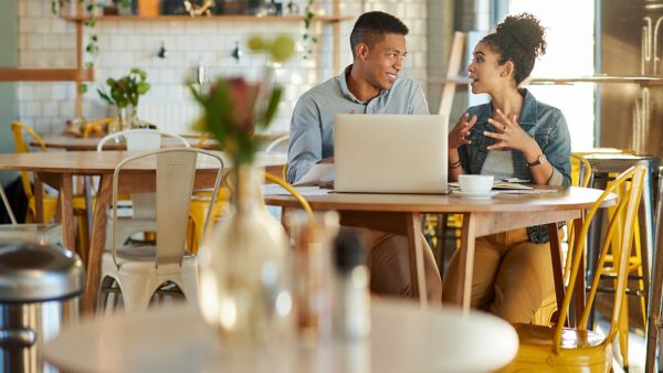 Restaurant owners on a laptop