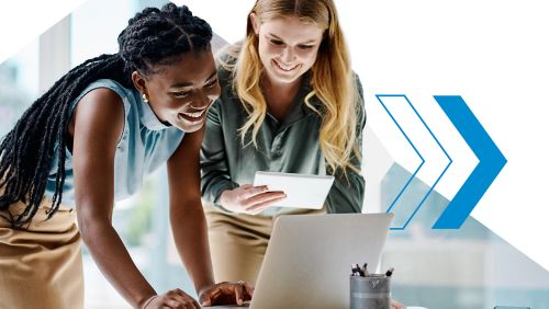 two people using a laptop and discussing AP automation