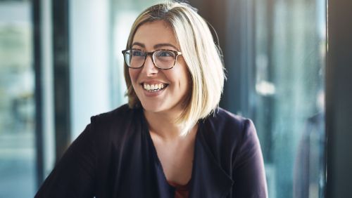 woman smiling learning about data driven marketing from deluxe