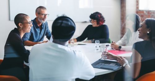 people in an office talking about supplier relationships