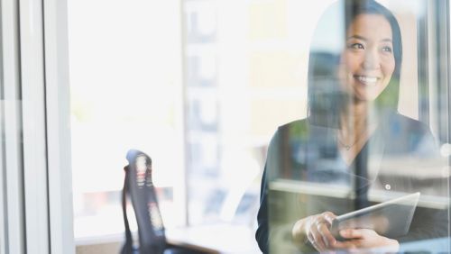 Woman gazing through a window