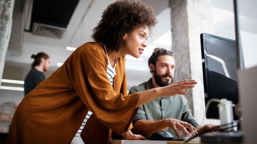 two colleagues talking about business trigger marketing
