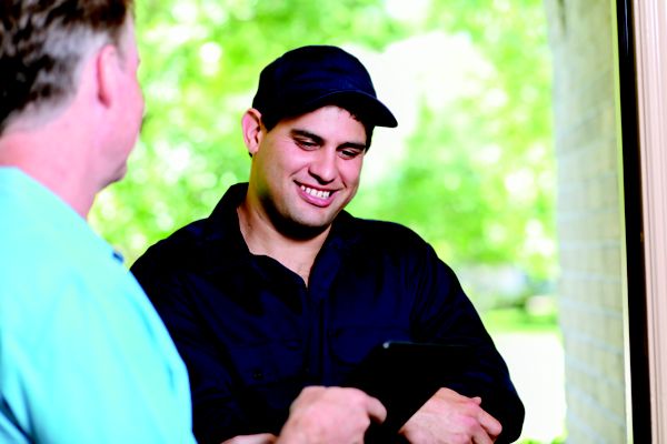 worker using tablet for payment