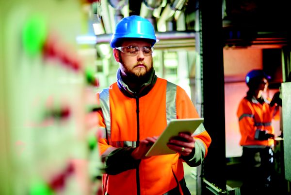 filed services worker on tablet