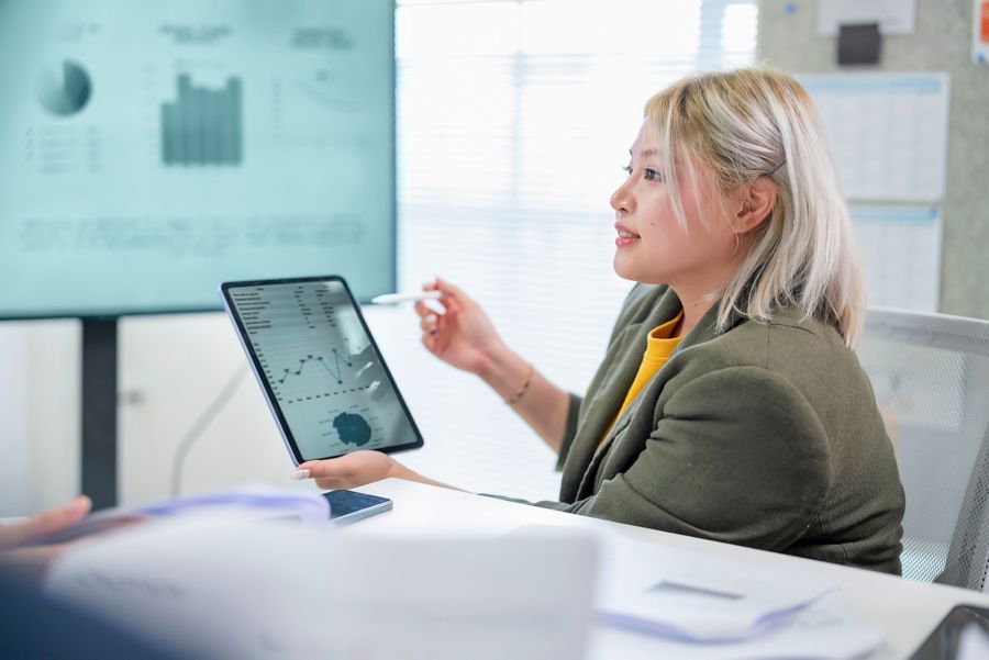 A man wearing glasses on a tablet with nodes