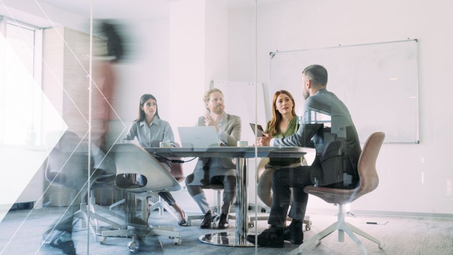A group of coworkers at a meeting table