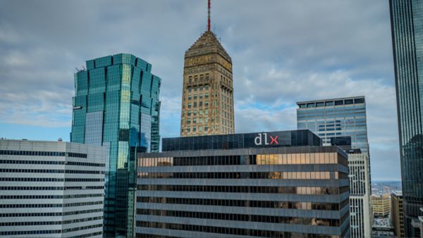 Deluxe's downtown Minneapolis location is shown with the Foshay Tower in the background.