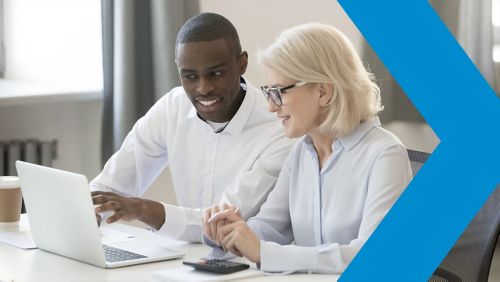 Man and woman working on computer