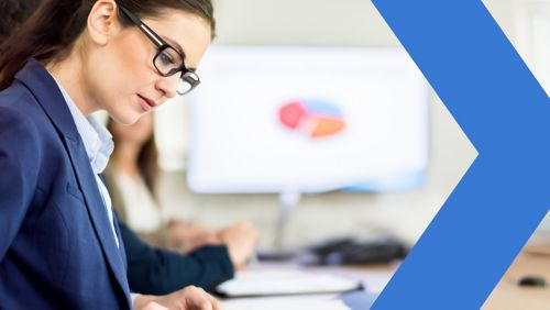 Female banker analyzing AR automation in meeting.