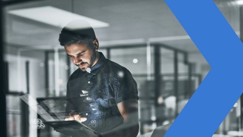 Financial institution worker analyzing digital payments on tablet.