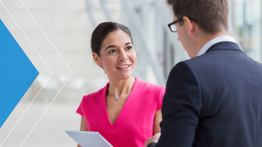 Medical professional talking to a man in a business suit
