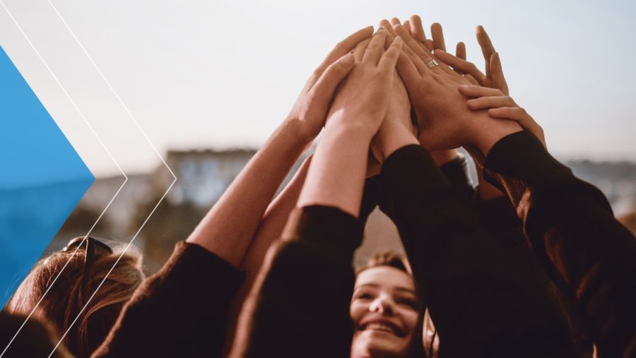 Volunteers doing a group high five.