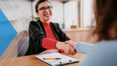 Banker shaking hands with a customer.