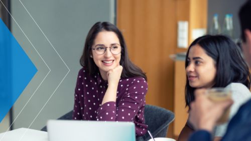 Middle market business AP team meeting in office to discuss fraud prevention best practices.