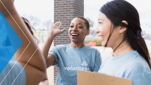 Young volunteers about to high five