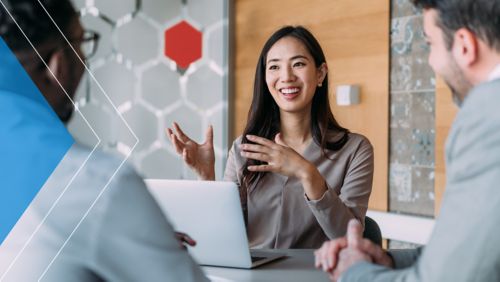 Financial marketer discussing strategy with her colleagues