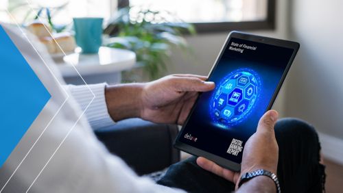 Man reading State of Financial Marketing report on tablet