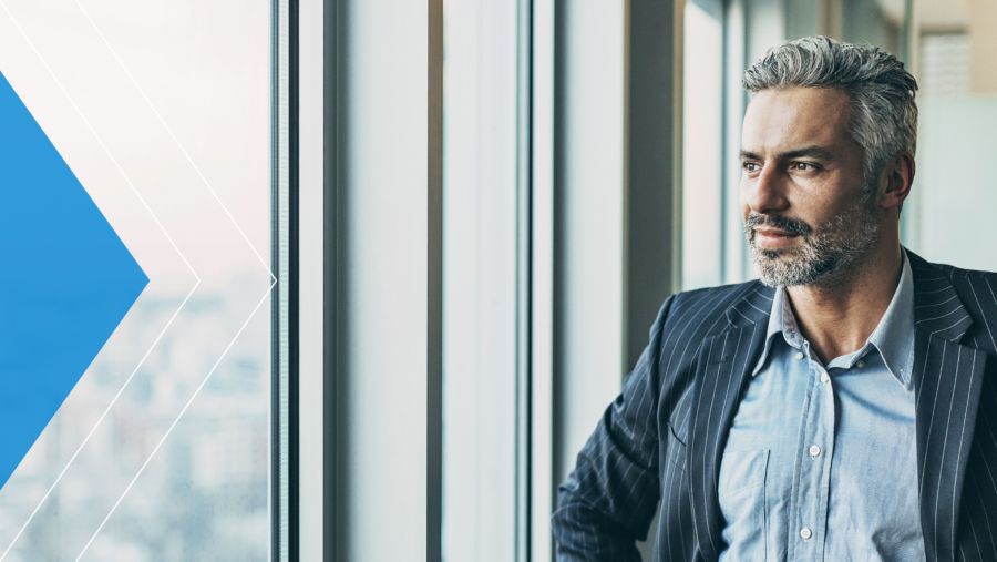 Businessman looking out window