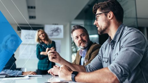 Corporate business team meets in office to discuss modern lockbox capabilities.