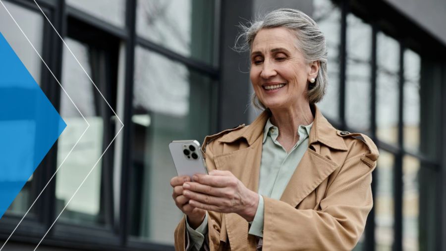 Woman smiling and using her smartphone