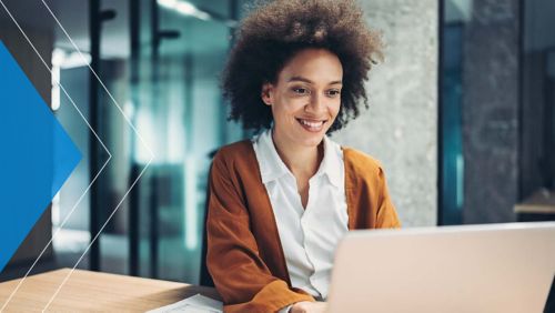 Woman using generative AI tool on laptop in office.