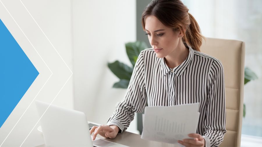 Business client analyzing payments on her laptop.