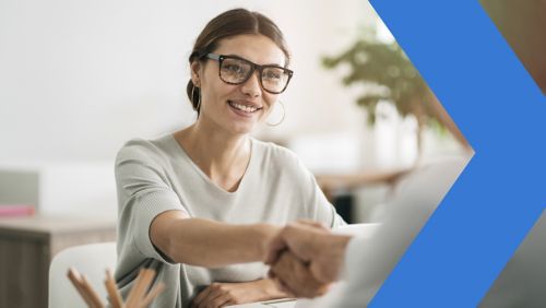 Female banker meets with business client in office.
