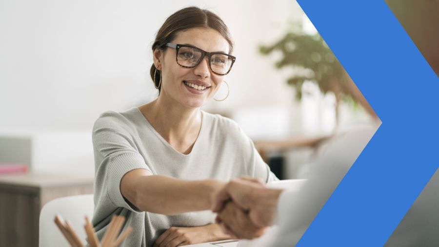 Female banker meets with business client in office.