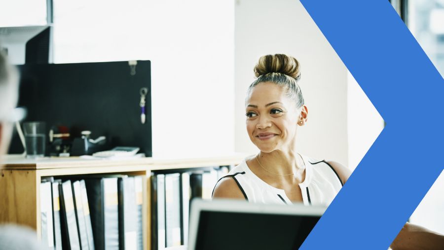 Photo of woman in office to accompany article about improving customer retention marketing through intent signals