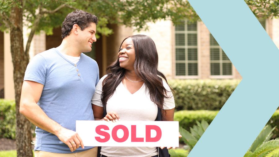 An excited young couple buys their first home