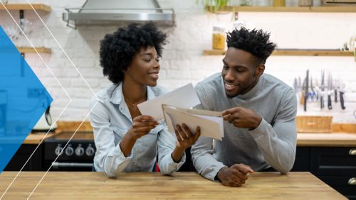 Couple reviewing direct mail that they received