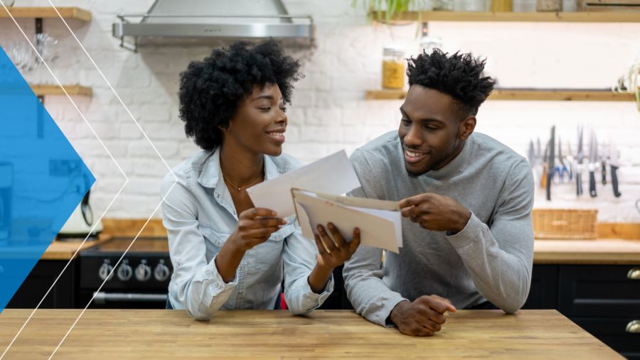 Couple reviewing direct mail that they received