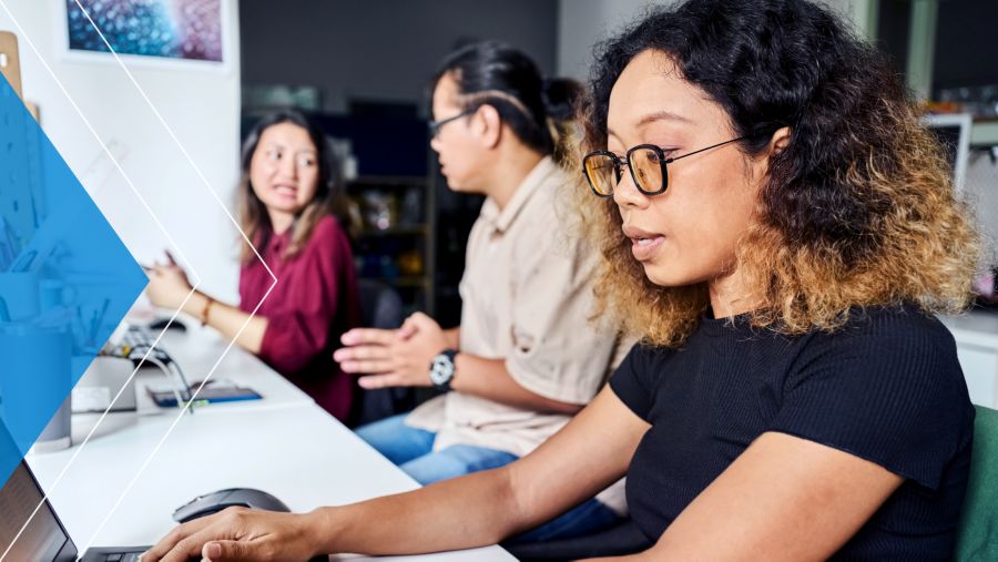 Woman doing deskwork with her colleagues at a nonprofit organization