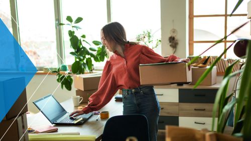 Small business owner looking at an inventory list.