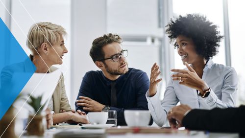 Group of marketers discussing AI strategy