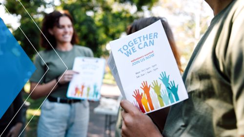 Teens handing out flyers for a volunteer project