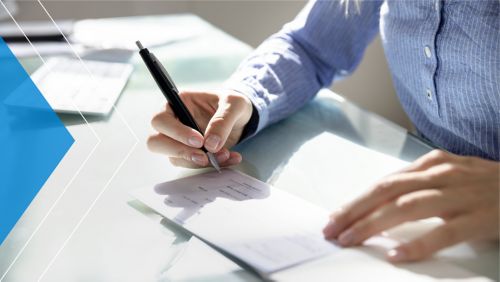 Woman writing a business check