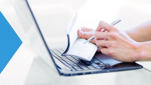 Close up of person writing a check.