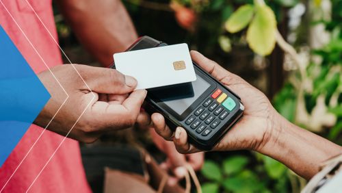 Merchant accepting payment via Tap to Pay device.