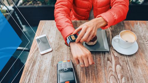 Person paying at a café with their smartphone. 