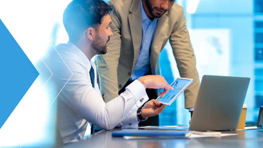 Two treasury professionals meeting to discuss Generative AI in finance. 