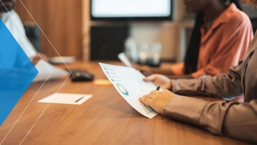 Corporate accounts receivable team discusses the role of data in their AR process during meeting.