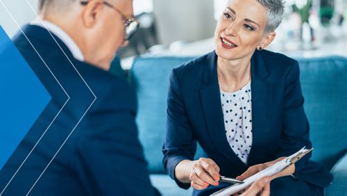 Business banker helping a small business owner with merchant services