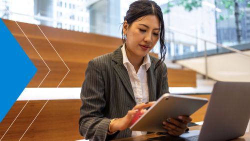 Mid-market AP employee assessing automation vendors on iPad using list of considerations. 