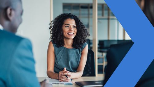 Coworkers meeting in financial institution office