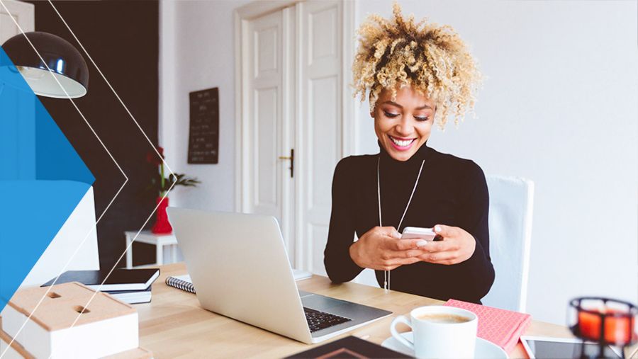 Woman using her smartphone and smiling.