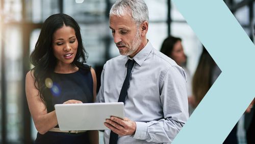 bank employees looking at tablet