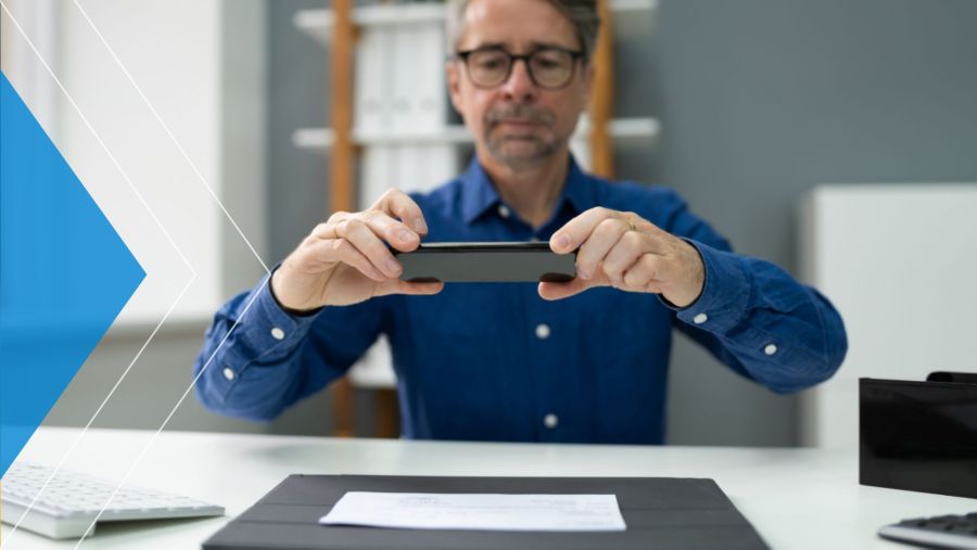 Business owner scanning a check with his phone using mobile Remote Deposit Capture+
