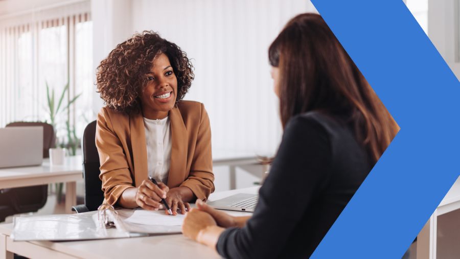 Banker discusses payment automation with business customer. 